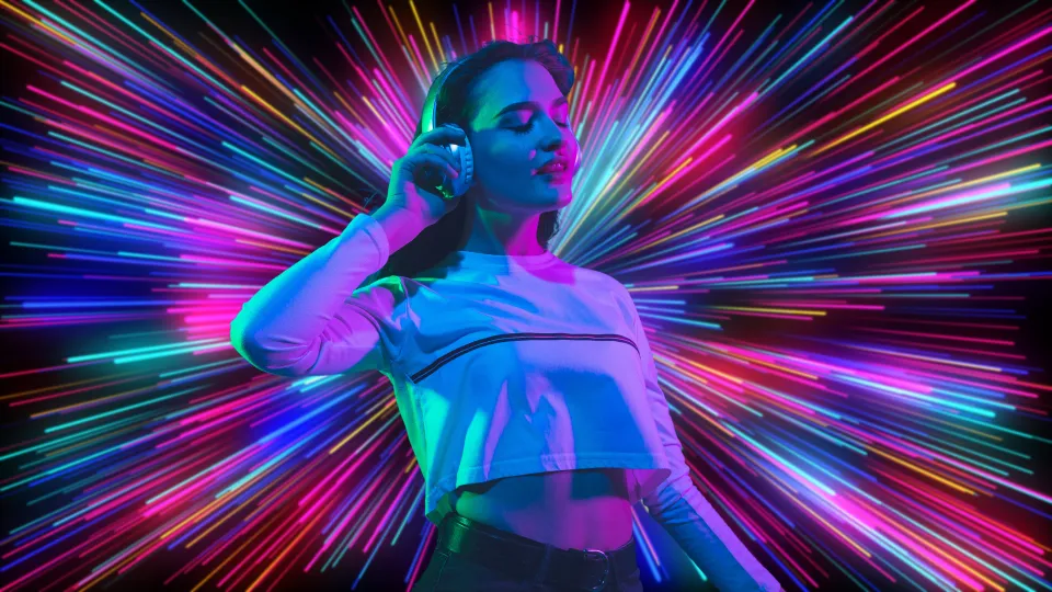 Characteristics of retrowave, a picture of a young woman with headphones, in front of hundreds of neon-like lights